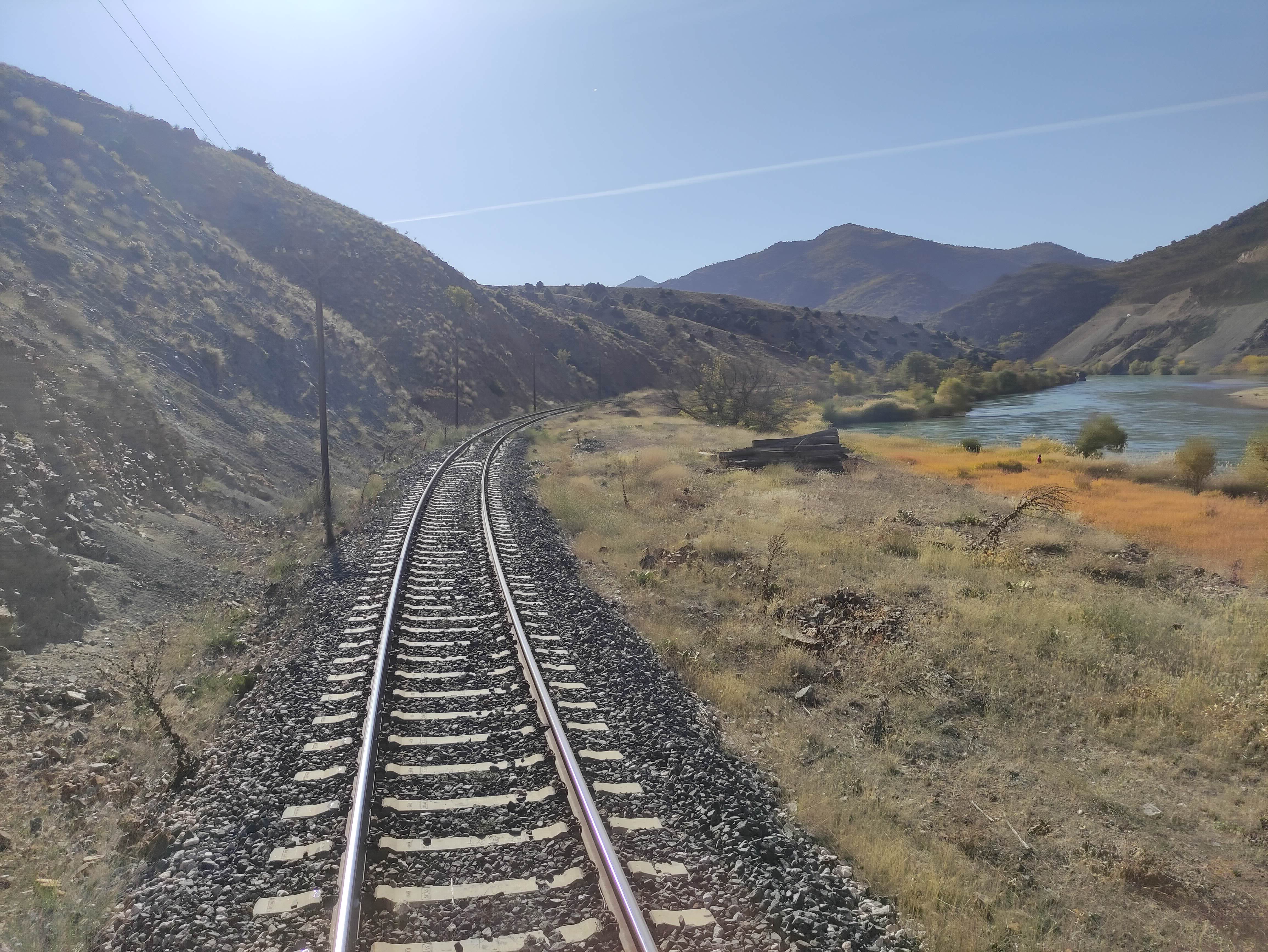 Views of the track from the back of the train. Photos were easy to take here because you could just open the door of the moving train and peek right out. View of railway tracks from the back of the last carriage